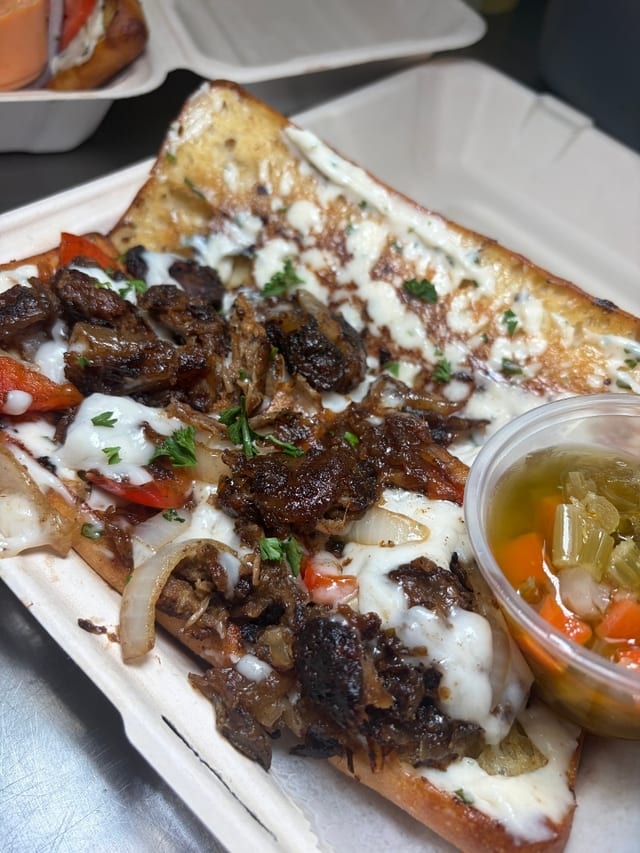 Oxtail Philly Cheesesteak w/ Truffle Fries.